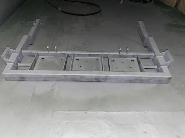 Frame section with gray primer coat during preparation