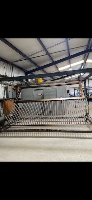 Livestock chute platform hanging in coating booth