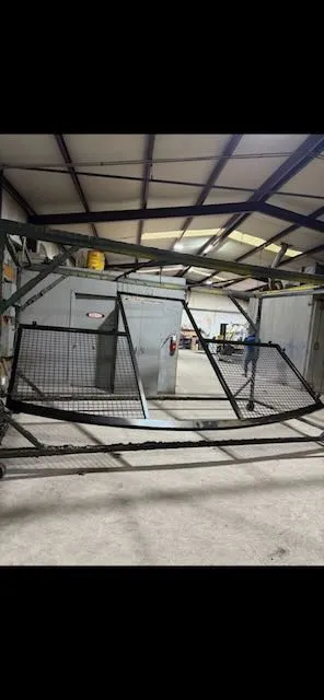 Dark powder coated frames with mesh panels in completed barn